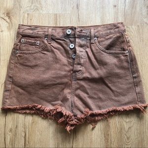 Acid washed burnt orange denim shorts